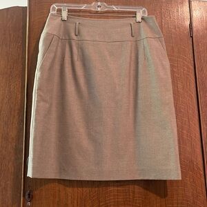 Knee length brown skirt with pockets. Wide waistband.